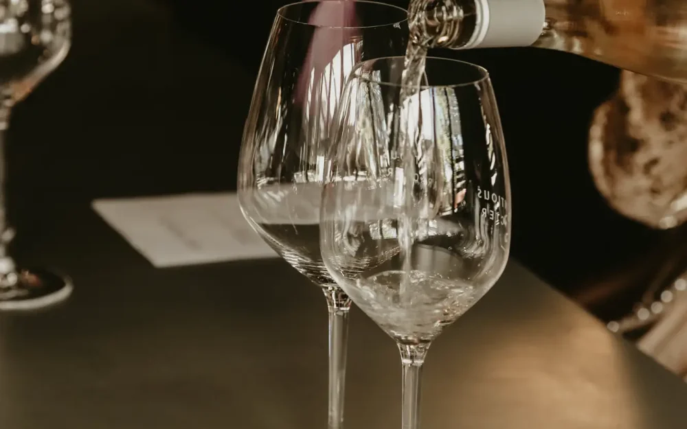 Pouring a glass of white wine